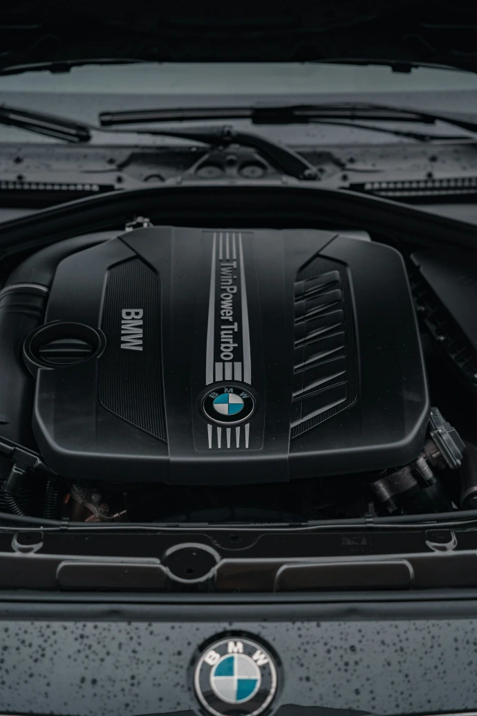the engine of a bmw car with its hood open